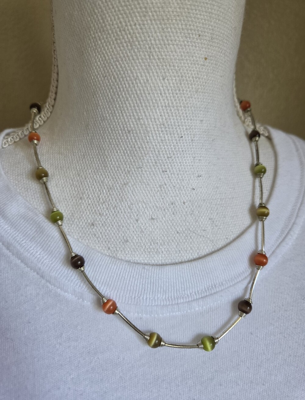 cats eye glass bead curved tube bar station necklace earth tones silver tone